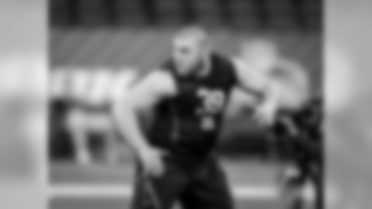 Washington offensive lineman Coleman Shelton runs a drill during the NFL football scouting combine, Friday, March 2, 2018, in Indianapolis. (AP Photo/Darron Cummings)