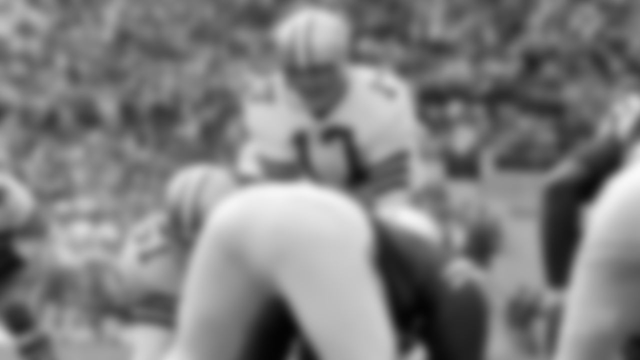Dallas Cowboys quarterback Don Meredith (17) prepares to take the snap from center Dave Manders (51) during the 1965 Playoff Bowl against the Baltimore Colts on January 9, 1966 in Miami. The Colts defeated the Cowboys 35-3. (AP Photo/NFL Photos)