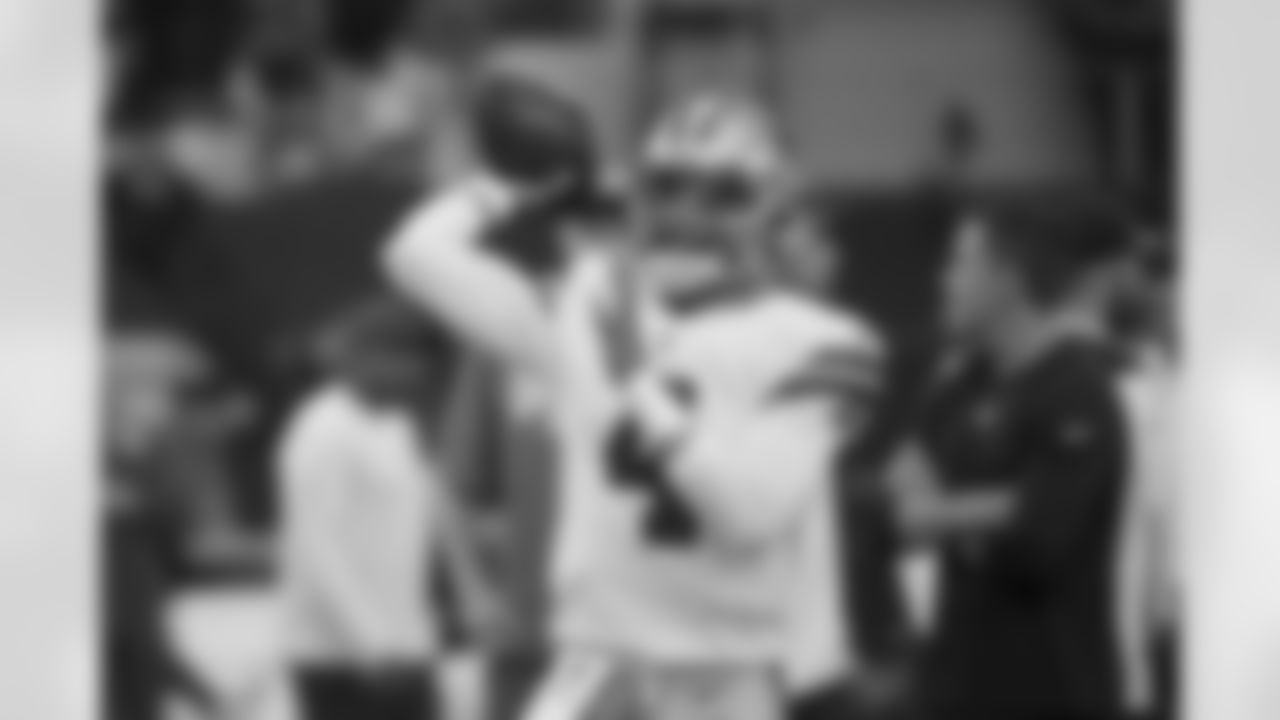 ]Dallas Cowboys quarterback Dak Prescott warms up before the first half of an NFL football game against the New York Giants in Arlington, Texas, Sunday, Oct. 10, 2021. (AP Photo/Ron Jenkins)O