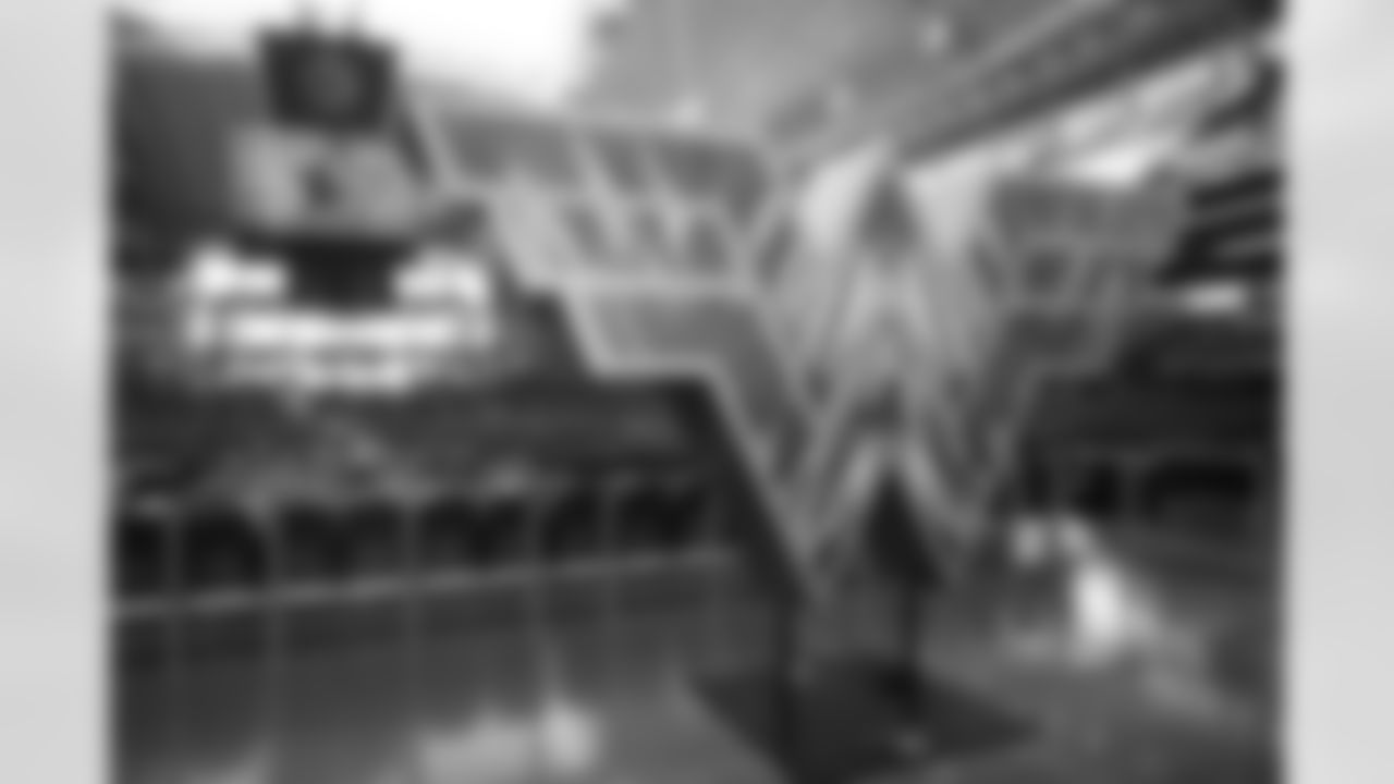 A sculpture in the shape of the "Wonder Woman" logo sits on the main concourse of AT&T Stadium before an NFL football game between the San Francisco 49ers and Dallas Cowboys in Arlington, Texas, Sunday, Dec. 20, 2020. (AP Photo/Michael Ainsworth)