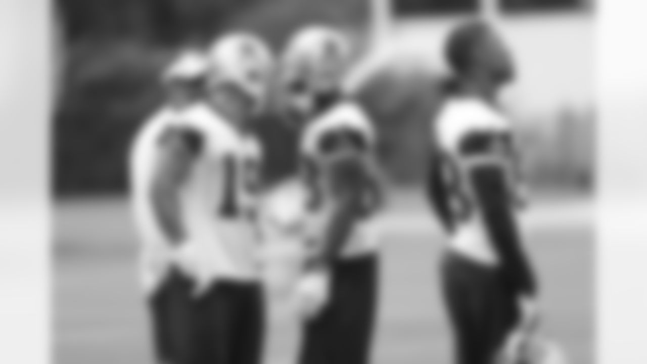 WRs Miles Austin and Dez Bryant chat during OTAs.