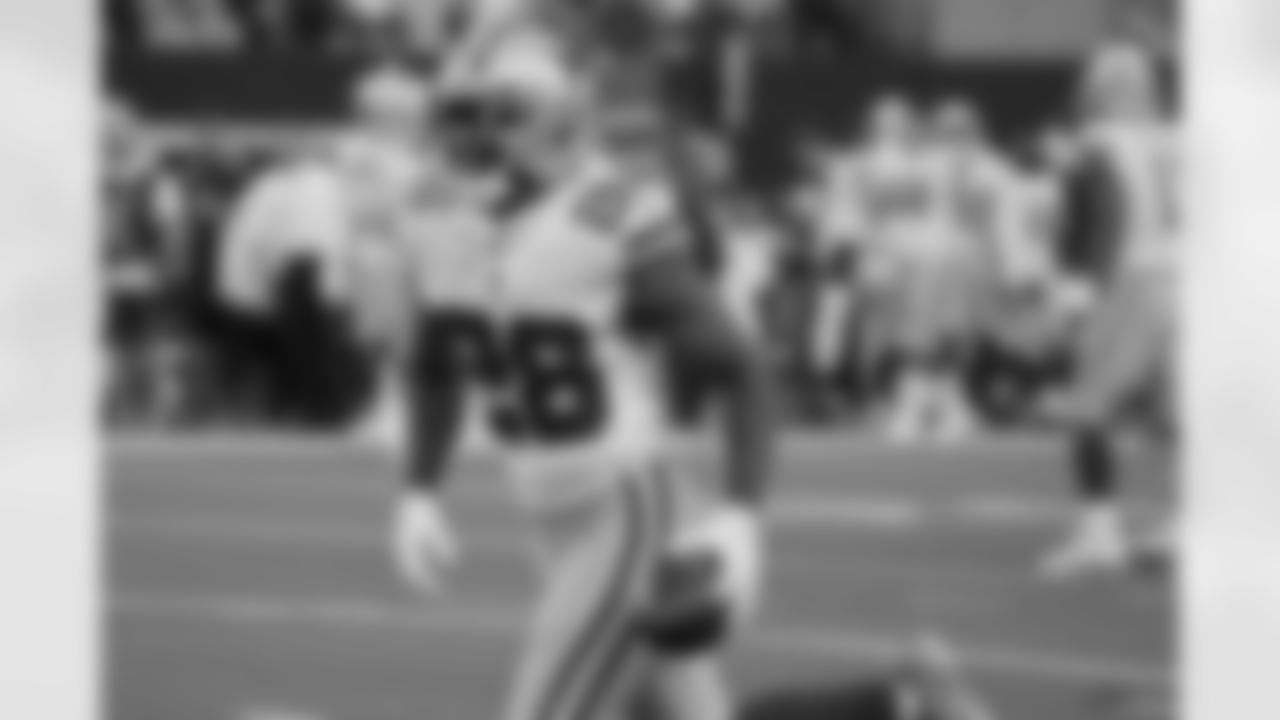 Dallas Cowboys cornerback Jourdan Lewis celebrates intercepting a pass in the second half of an NFL football game against the Atlanta Falcons in Arlington, Texas, Sunday, Nov. 14, 2021. (AP Photo/Michael Ainsworth)