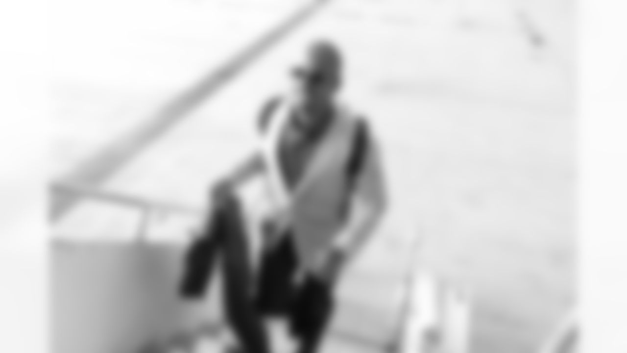WR Miles Austin boards the team charter.