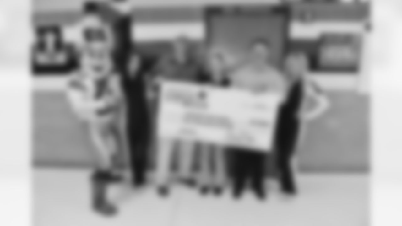 rowdy_photo_-_with_dcc_and_whataburger_staff_presenting_2000_check_to_burleson_hs_coach_of_the_week_2014_0.jpg