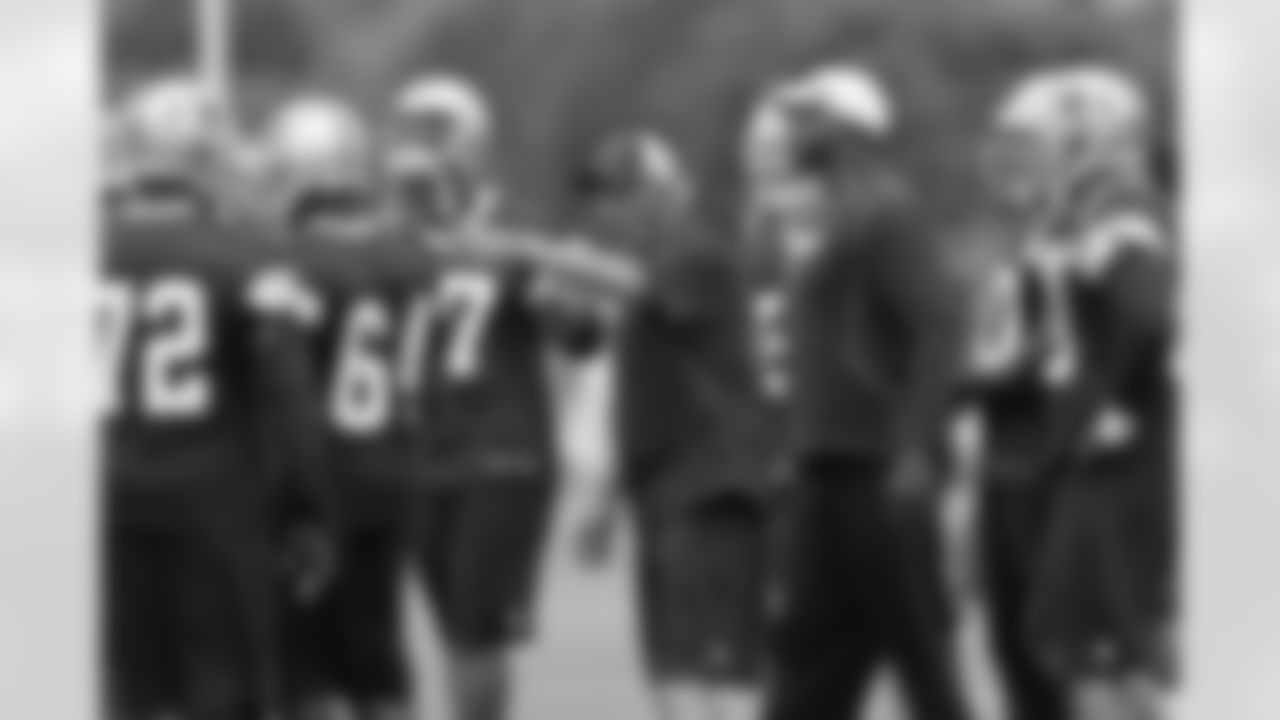 Defensive coordinator Monte Kiffen works with the defense during OTAs.