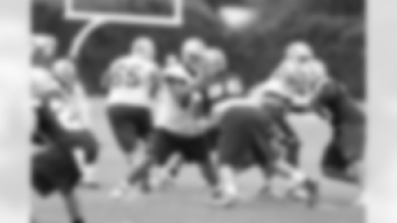 First round pick Travis Frederick blocks during team drills.