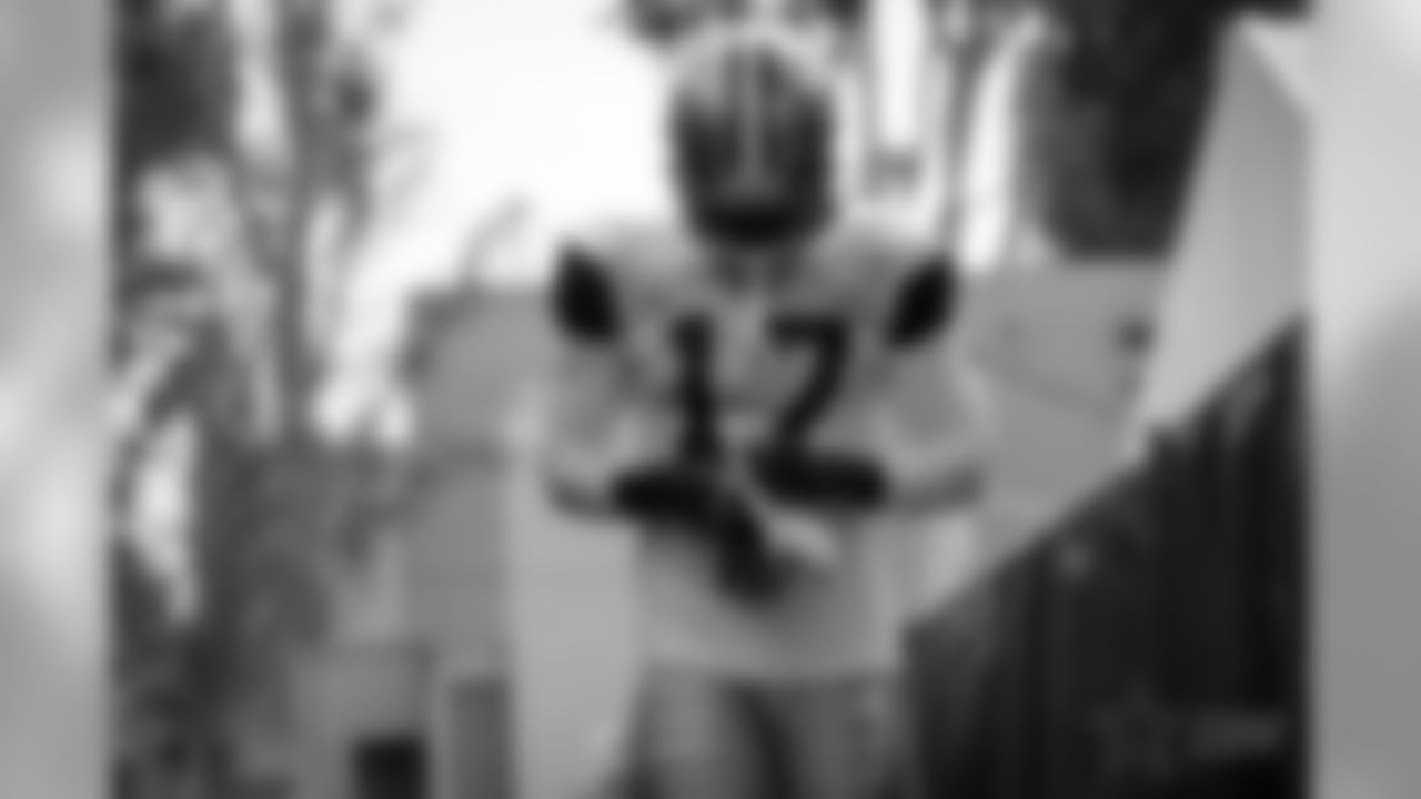 Views of the Dallas Cowboys as they take the field for the first time in pads for afternoon training camp practice at the River Ridge Complex in Oxnard, CA