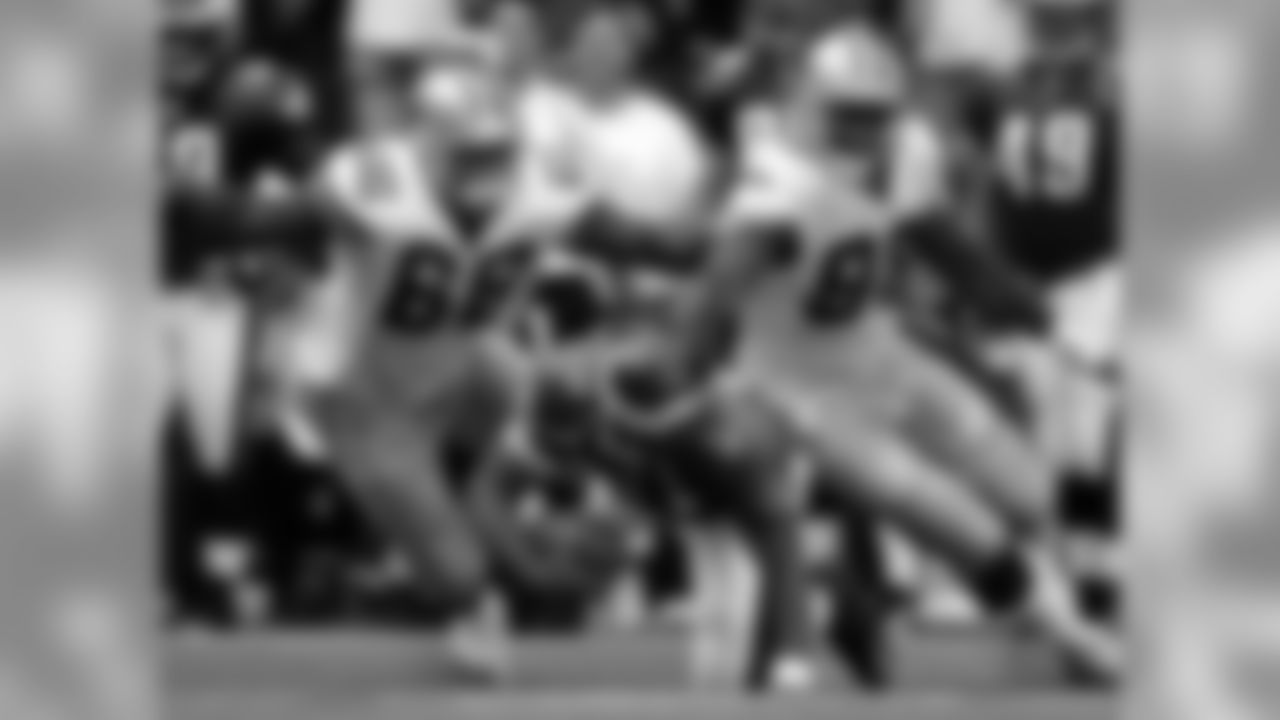 2005 - Ratliff (#66) and Greg Ellis sack Eagles' QB Donovan McNabb during a game at Texas Stadium in Irving, TX.