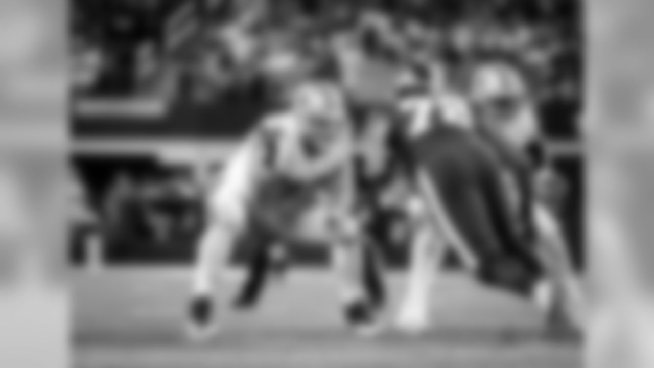Dallas Cowboys offensive lineman Travis Frederick (72) snaps the ball during an NFL football game against the Washington Redskins on Thursday, Nov. 30, 2017 in Arlington, Texas. The Cowboys won the game, 38-14. (Greg Trott via AP)