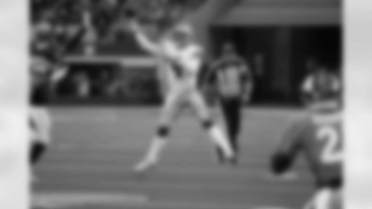 Denver Broncos' Jonathon Cooper (53) and Ronald Darby, right, defend as Dallas Cowboys quarterback Dak Prescott (4) throws a pass in the second half of an NFL football game in Arlington, Texas, Sunday, Nov. 7, 2021. (AP Photo/Ron Jenkins)