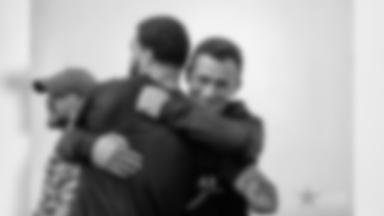 Former Texas A&M University Aggies quarterback Johnny Manziel hugs former teammate Tampa Bay Buccaneers wide receiver Mike Evans (13) during Texas A&M Pro Day at the NCAA football team's indoor training facility on Tuesday, March 27, 2018 in College Station, Texas. (Aaron M. Sprecher via AP)