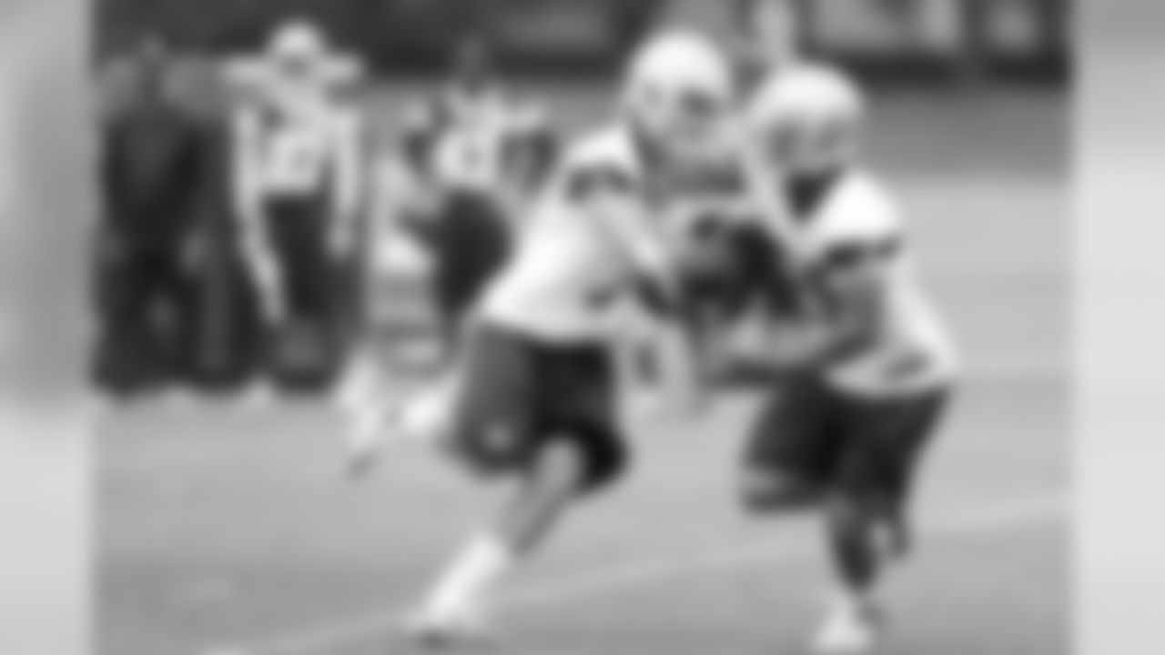 Dalton Williams hands the ball off to rookie RB Kendial Lawrence