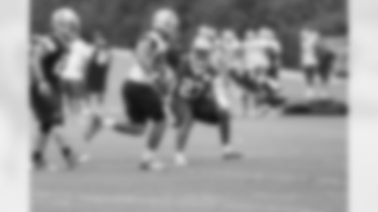 Safety J.J. Wilcox and TE James Hanna during OTAs.