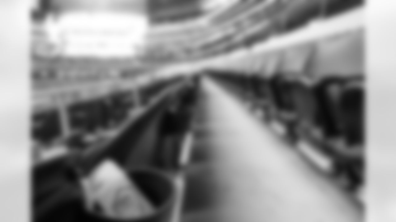 Sanitization wipes are placed in cup holders for fans to combat the spread of COVID-19 before an NFL football game between the New York Giants and Dallas Cowboys, Sunday, Oct. 11, 2020, in Arlington, Texas. (AP Photo/Brandon Wade)