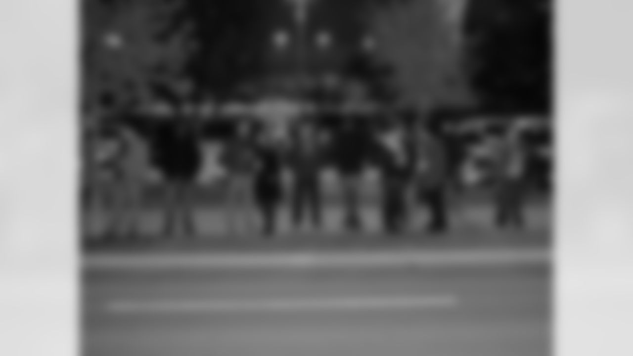 A crowd gathers to watch the project.