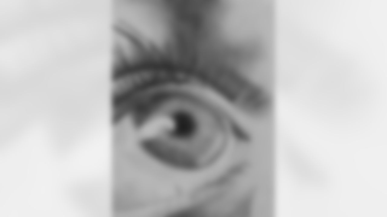 GREEN EYE LOOKING UP
Artist: Amaniya Hayat
Description: This artwork is composed of a close up of a green eye looking upwards at something off the page. The close up angle provides an interesting perspective as the sole focus of the artwork is the eye itself become of how the color of the iris contrasts with the surrounding skin. This contrast is complemented by how the dark lashes act as a frame for the eyeball as it reflects the light of what it is looking at. This symbolizes how individuals look up to an unseen goal or a vision as a way of motivating themselves to achieve. In this way, individuals envision their dreams and make it a goal of theirs to achieve as they look forward to and yearn for it.