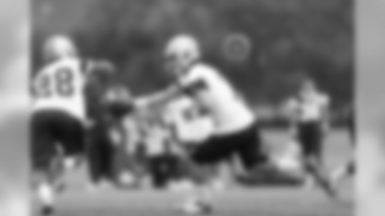 QB Dalton Williams hands off the ball during practice.