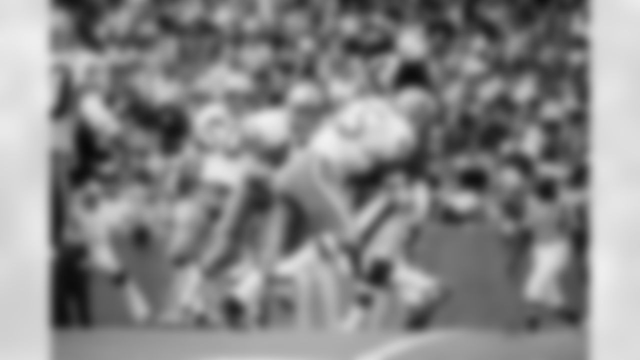 Philadelphia Eagles wide receiver Harold Carmichael is swarmed by the Dallas Cowboys defense in third period action in Irving, Texas, Nov. 15, 1971. Cowboy defenders led by linebacker Lee Roy Jordan held Varmichael to short gain. Others are safety Cliff Harris and linebacker D. D. Lewis. (AP Photo)