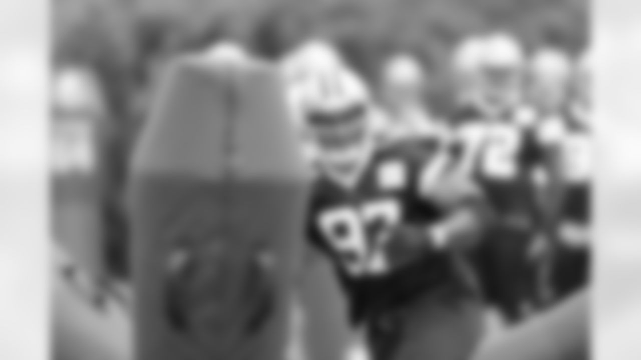 DT Jason Hatcher takes down a tackle dummy.