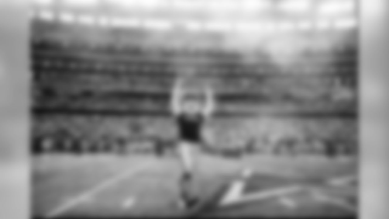 rowdy_photo_-_blue_t-shirt_on_field_during_intros_at_playoff_game_2015_0.png
