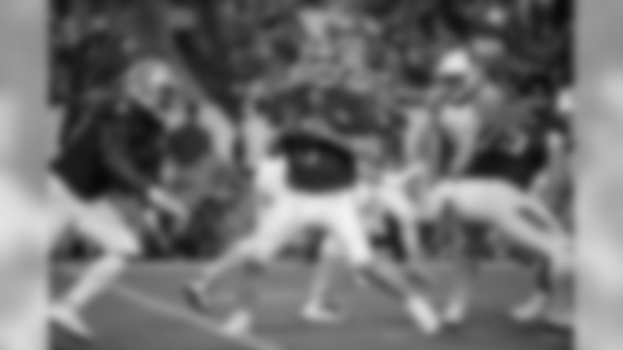 Dallas Cowboys' Tony Romo looks to pass during the first half of the NFL Football Pro Bowl Sunday, Jan. 25, 2015, in Glendale, Ariz. (AP Photo/Mark Humphrey)