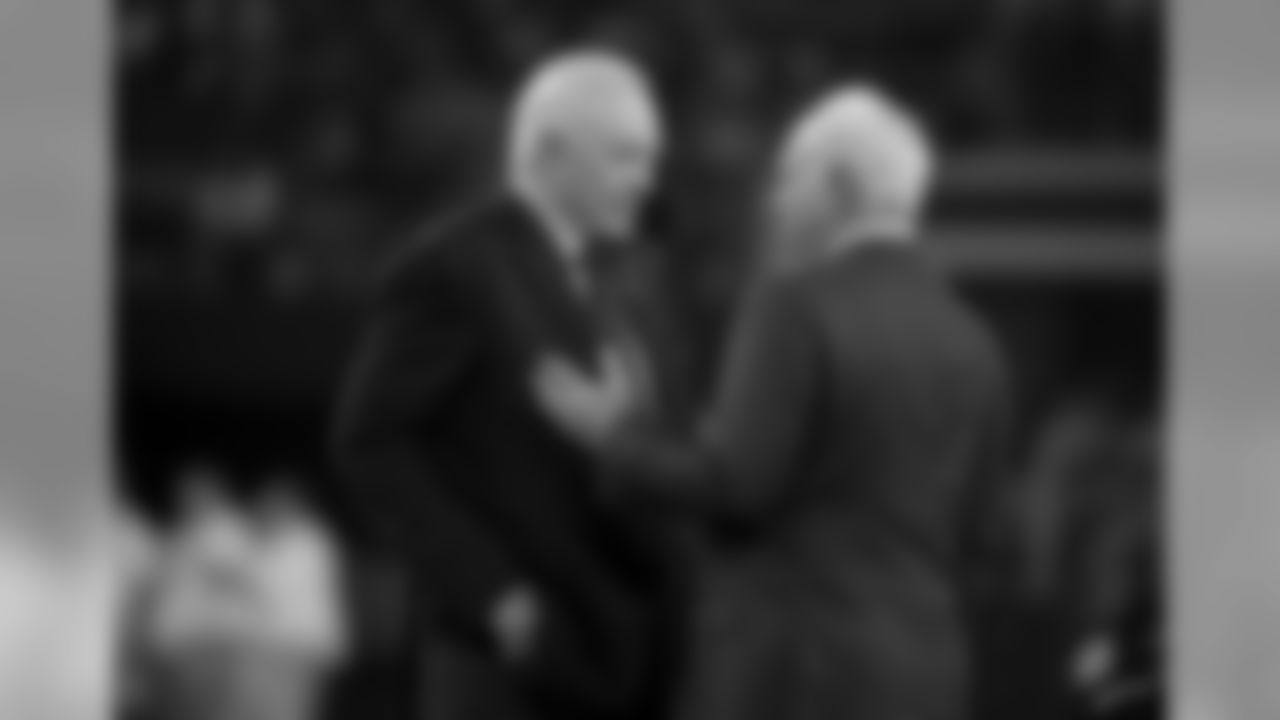 Dallas Cowboys team owner Jerry Jones, and Philadelphia Eagles owner Jeffrey Lurie, right, talk on the field before an NFL football game in Arlington, Texas, Oct. 20, 2019. (AP Photo/Michael Ainsworth)