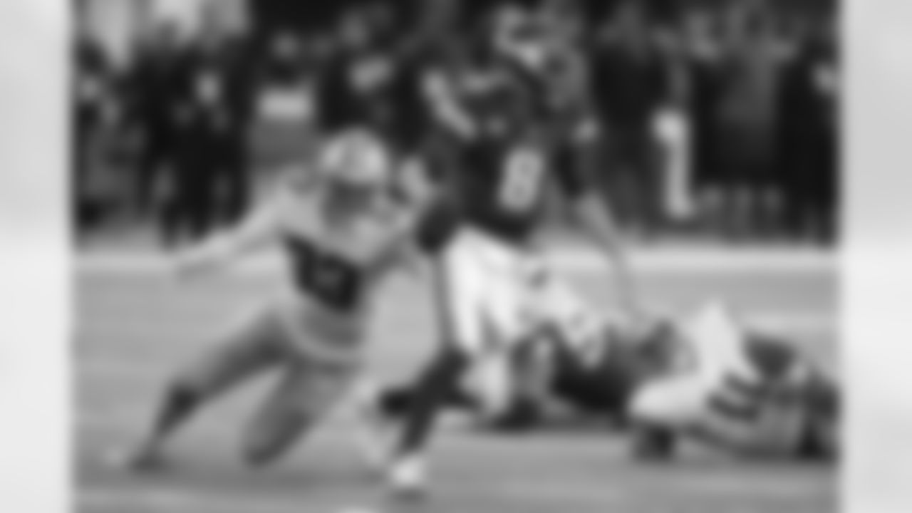 Minnesota Vikings quarterback Kirk Cousins (8) runs from Dallas Cowboys defensive end Tarell Basham (93) during the second half of an NFL football game, Sunday, Oct. 31, 2021, in Minneapolis. The Cowboys won 20-16. (AP Photo/Jim Mone)