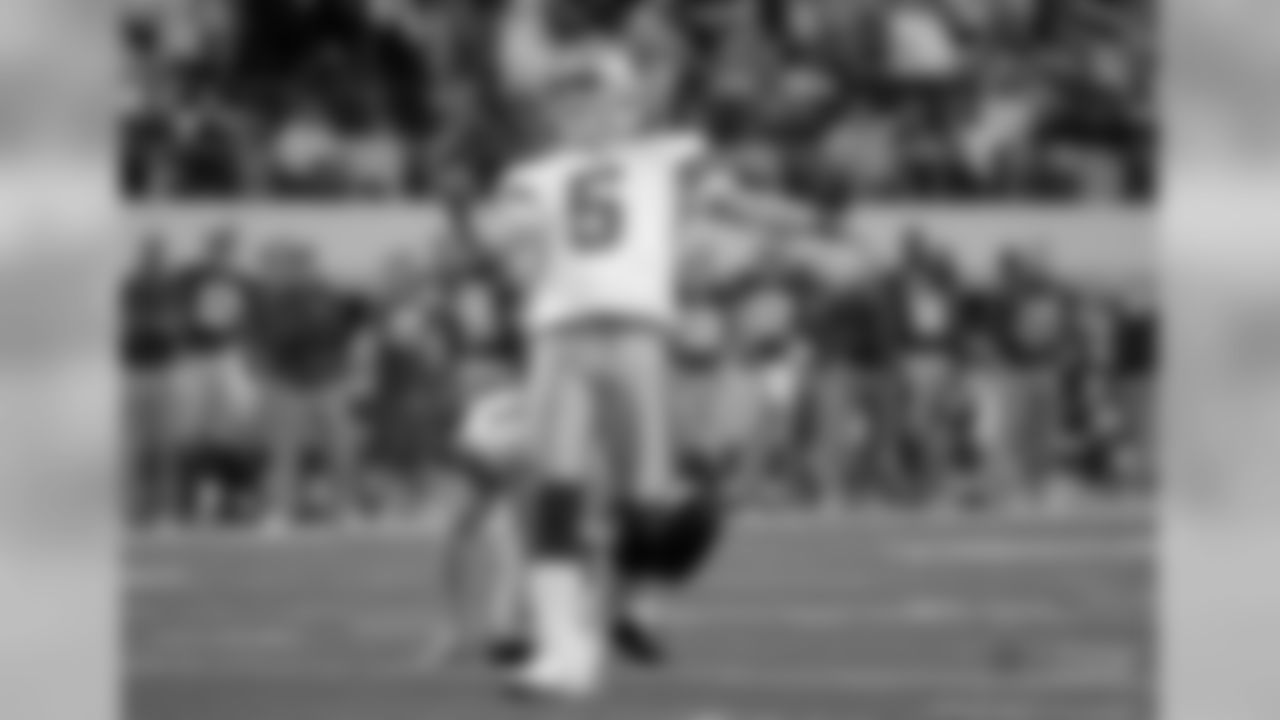 Dallas Cowboys kicker Dan Bailey (5) looks on at a field goal attempt as punter Mat McBriar (1) holds during an NFL football game against the New York Giants Sunday, Dec. 11, 2011, in Arlington, Texas. The Giants won 37-34. (AP Photo/Tony Gutierrez)