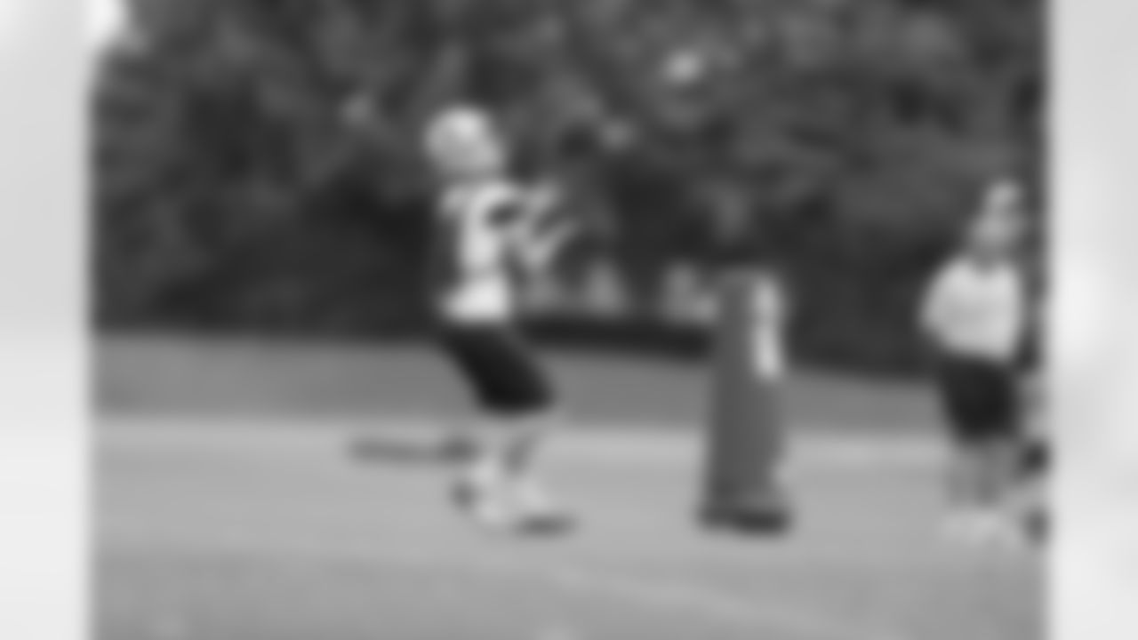 WR Cole Beasley catches a punt during team drills.