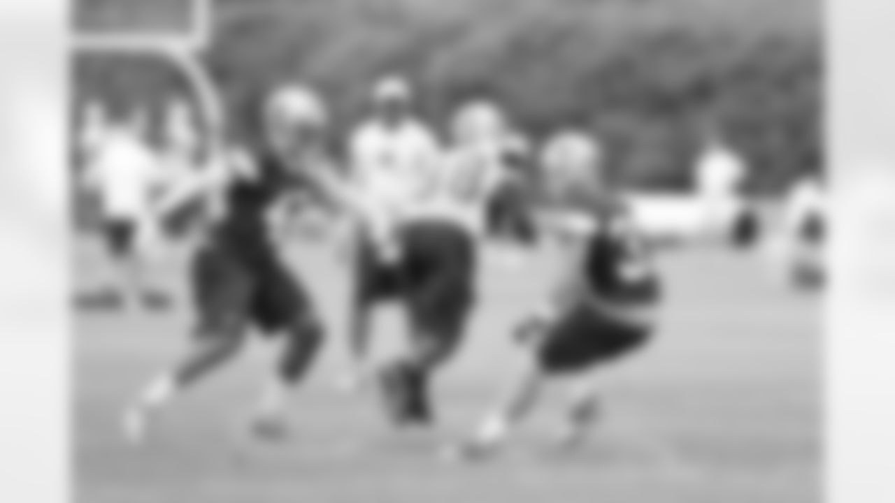 Dez Bryant runs through safeties Barry Church and Matt Johnson during drills.