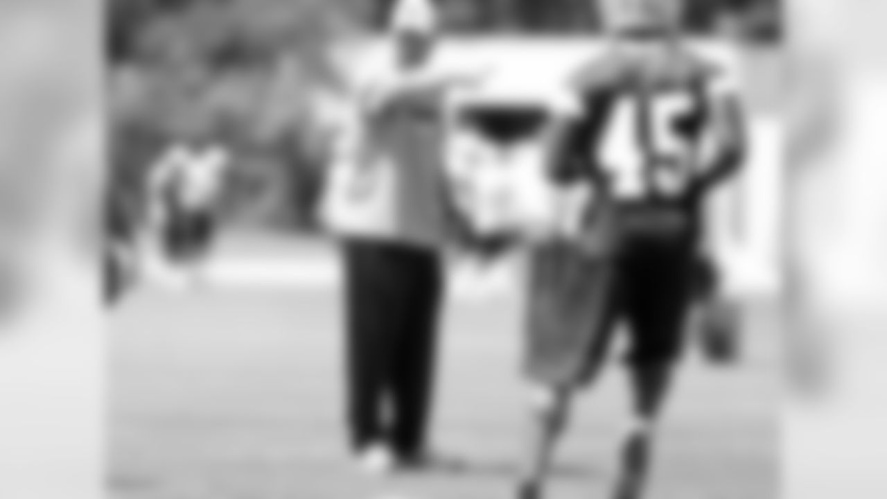 Matt Eburflus gives direction to the linebackers.