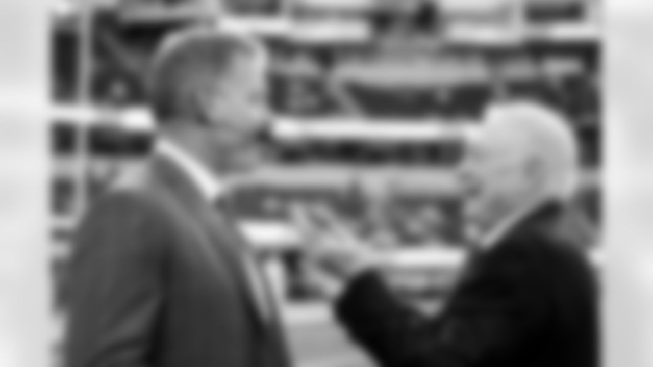 Former Dallas Cowboys quarterback Troy Aikman, left, and Cowboys owner Jerry Jones speak before an NFL football game against the Los Angeles Chargers, Monday, Oct. 16, 2023, in Inglewood, Calif. (AP Photo/Ashley Landis)