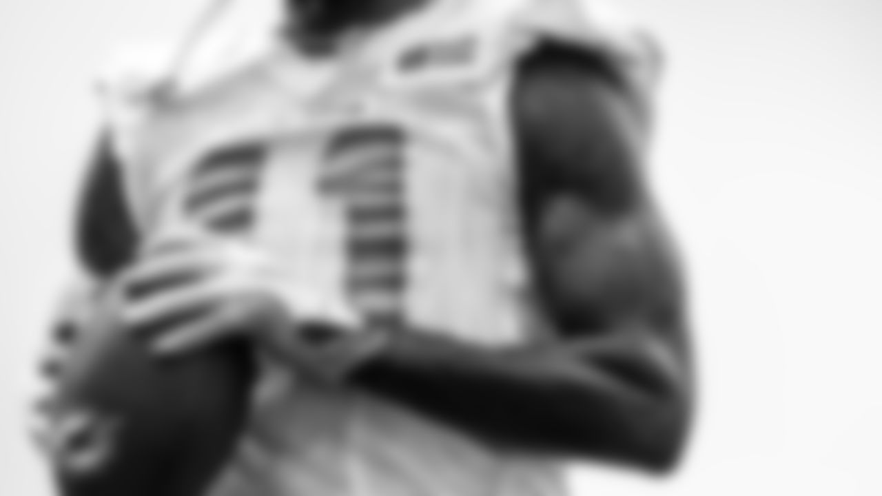 Miami Dolphins wide receiver DeVante Parker (11) walks back to the huddle with a football during training camp at the Baptist Health Training Complex on Monday, Aug. 2, 2021 in Miami Gardens, Fla. (Peter McMahon/Miami Dolphins via AP)