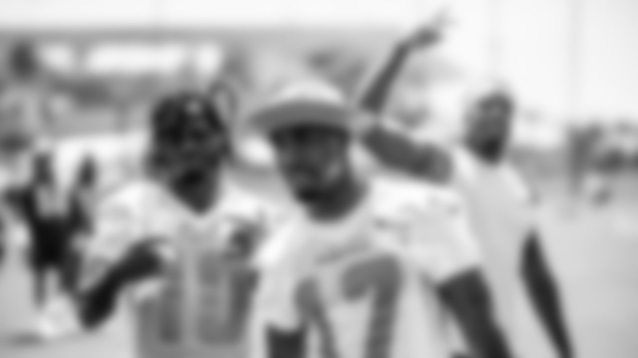 Miami Dolphins wide receivers Jaylen Waddle (17), Tyreek Hill (10) and safety Jevon Holland (8) during an Offseason Workout Thursday, May 5th, 2022 in Miami Gardens, Fla. (Peter McMahon/Miami Dolphins via AP)