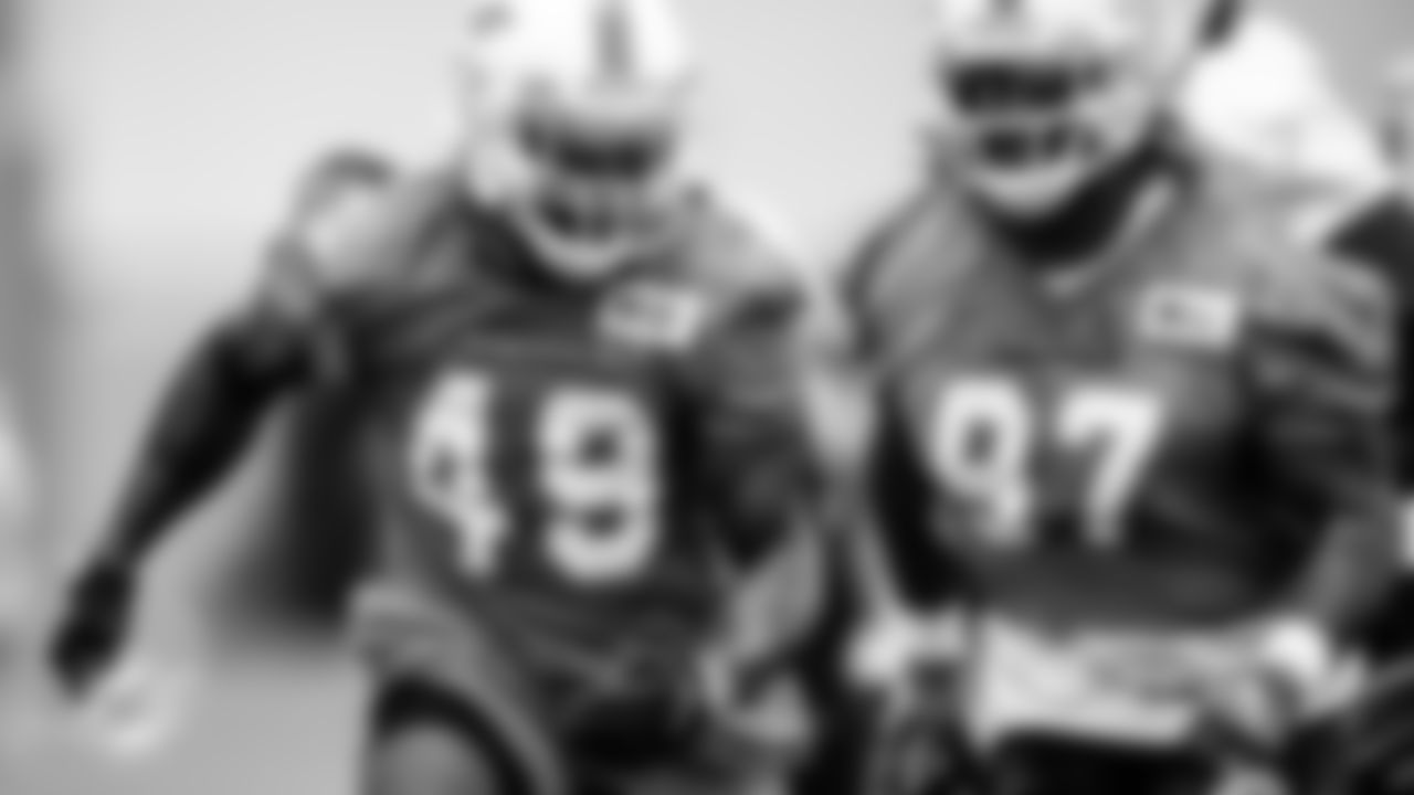Miami Dolphins linebacker Sam Eguavoen (49) and defensive lineman Jordan Williams (97) during an OTA Monday, May 23rd, 2022 in Miami Gardens, Fla. (Peter McMahon/Miami Dolphins via AP)