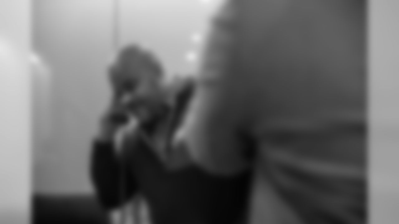 Assistant head coach/Running backs Duce Staley on the phone with RB Miles Sanders