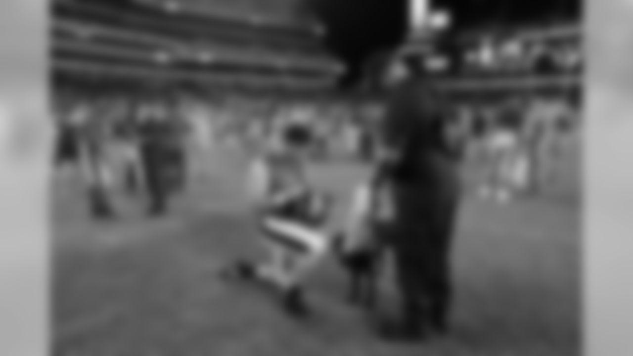 LS John DePalma takes a knee for an autograph