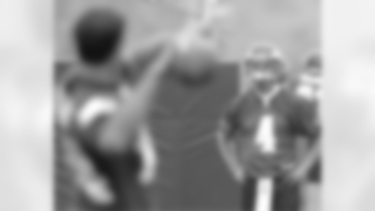 QB A.J. Feeley throws the ball to fellow QB Kevin Kolb during rain-shortened practice