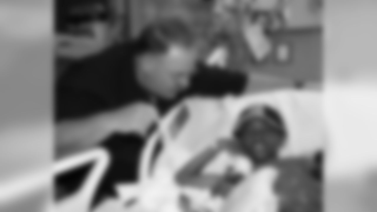 Head Coach Andy Reid visits child