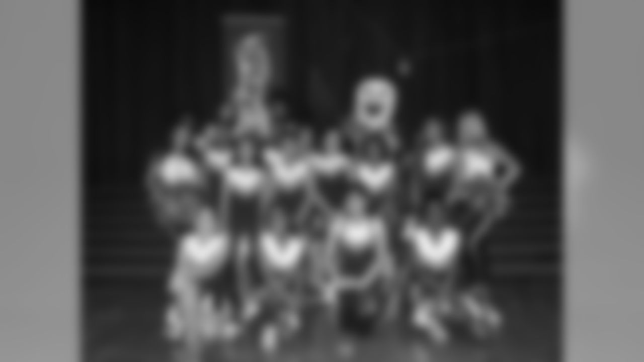 SWOOP hops in a photo with the cheerleaders