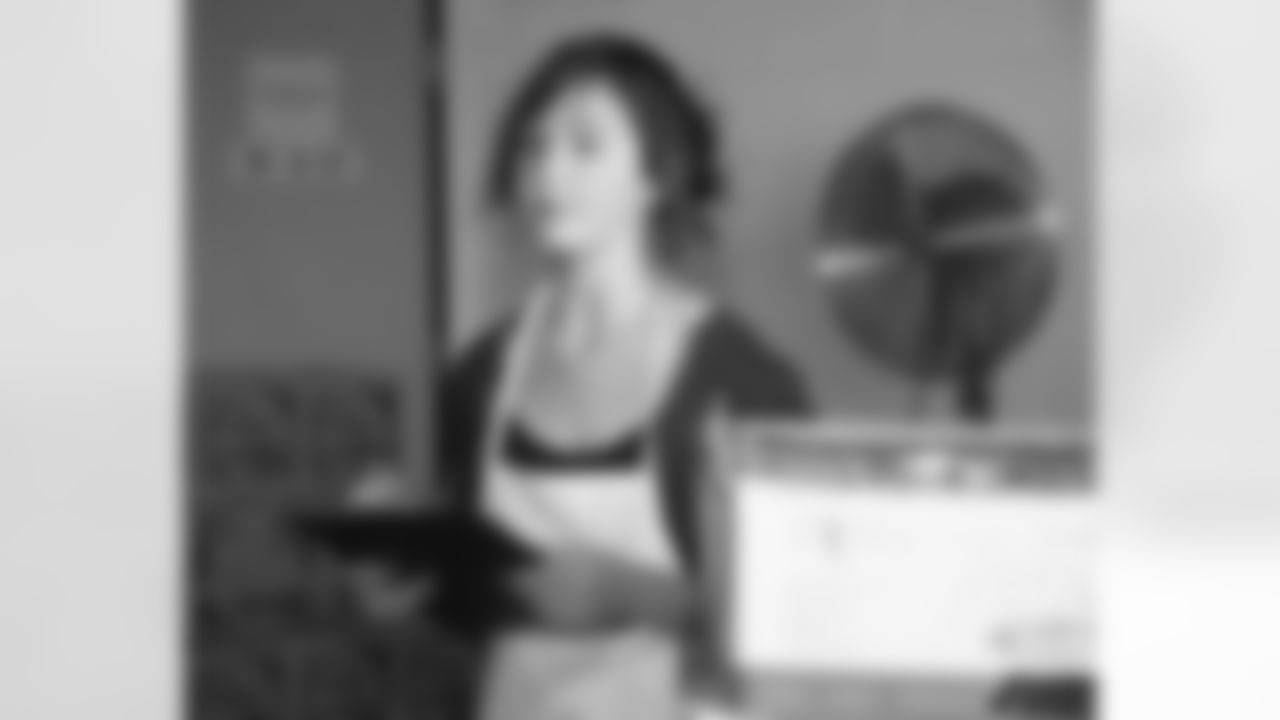 Molly Mornhinweg, daughter of Marty Mornhinweg, checks off the shelters supplies