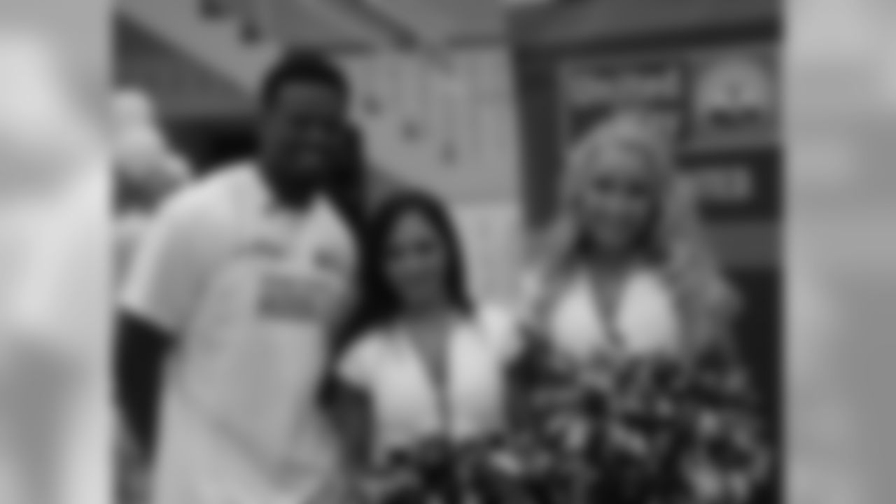 CB Bradley Fletcher joined by Eagles Cheer members Alycia and Pilar