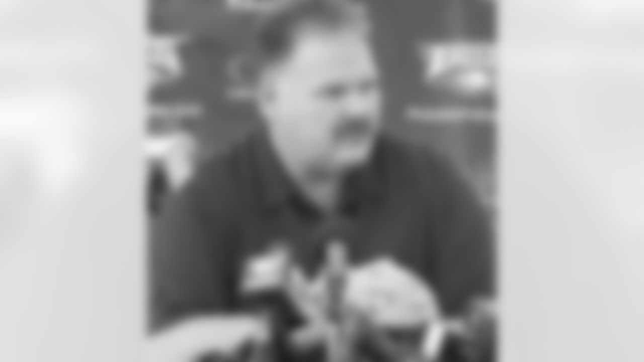 Head coach Andy Reid takes some notes