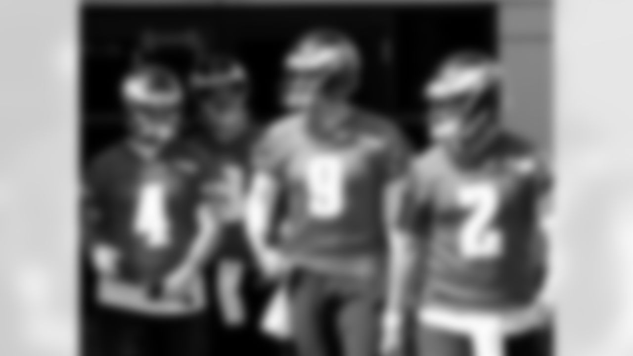 The QBs walking out to a very sunny practice