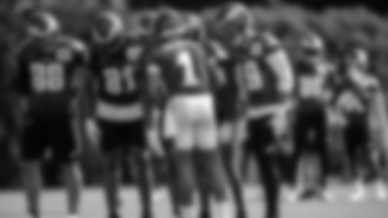 QB Jalen Hurts calls a play in the huddle