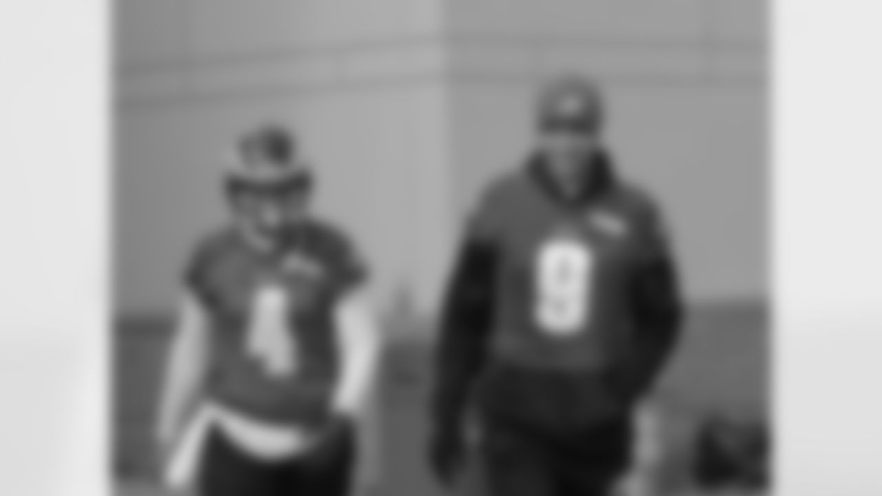 Quarterbacks G.J. Kinne and Nick Foles step onto the practice field