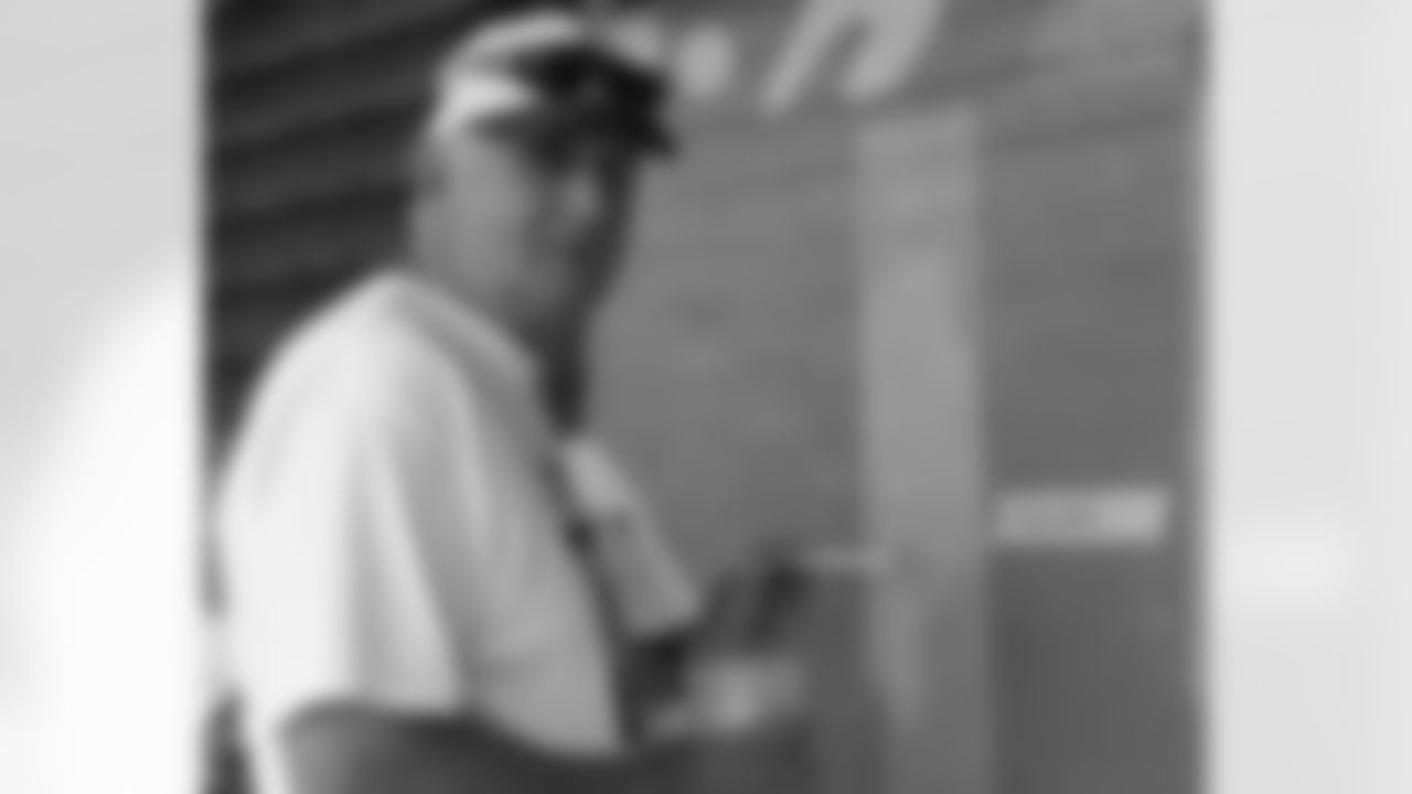 Defensive coordinator Jim Johnson was on the offensive as he painted mural
