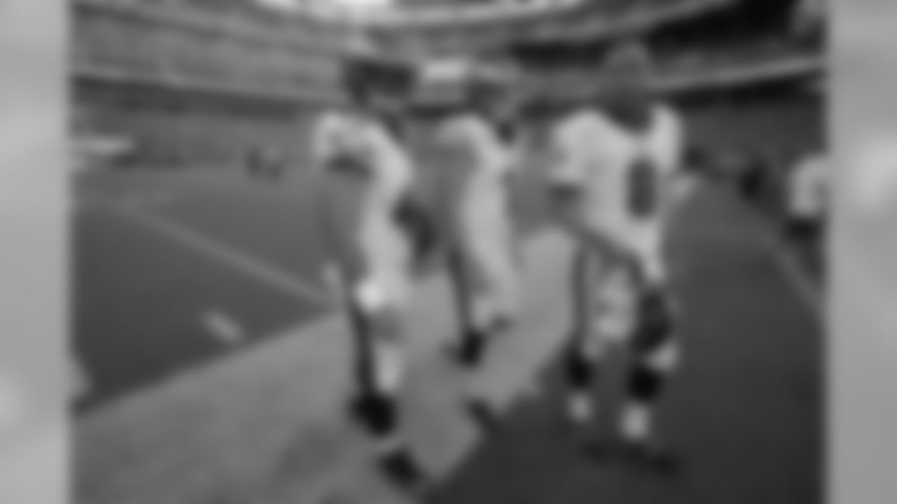 LS Jon Dorenbos, K Cody Parkey and P Donnie Jones exit the field after pregame warm-ups