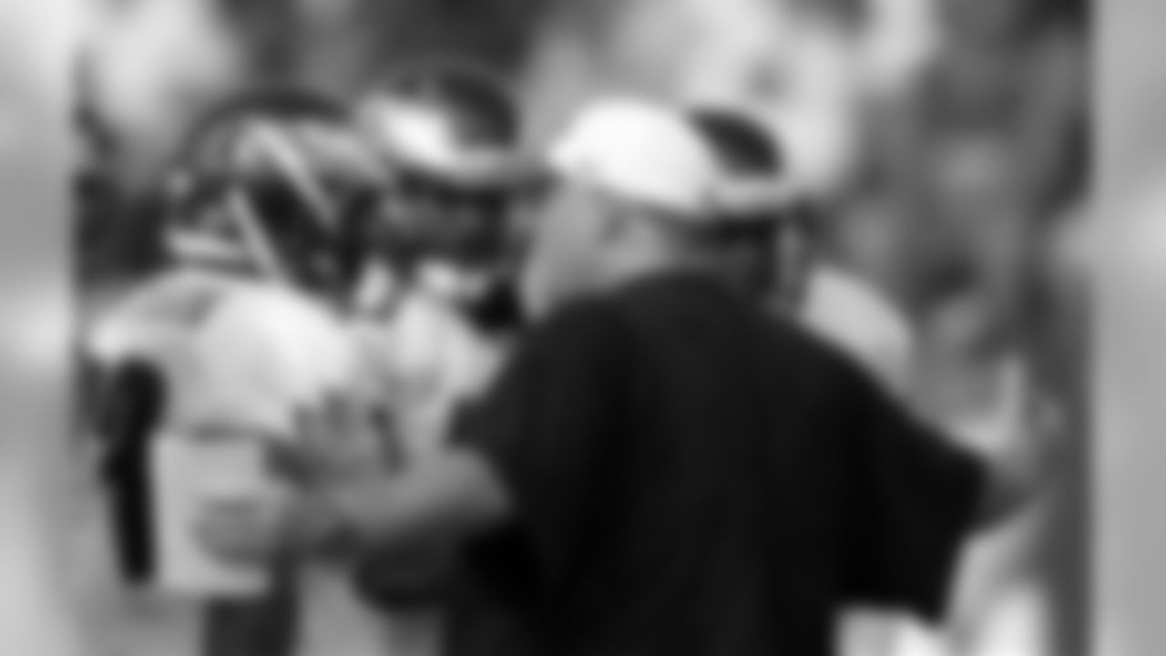 Head coach Andy Reid works with the defense