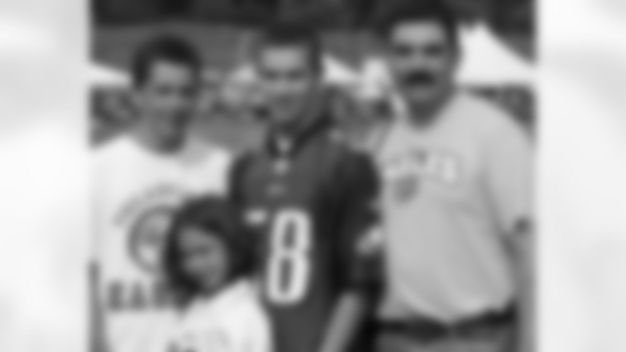 A father and his children at the Eagles Tuesday morning's practice
